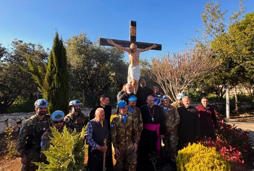 Photo of the Italian UNIFIL-backed replacement crucifix in Debel with clergy, villagers, and peacekeepers present